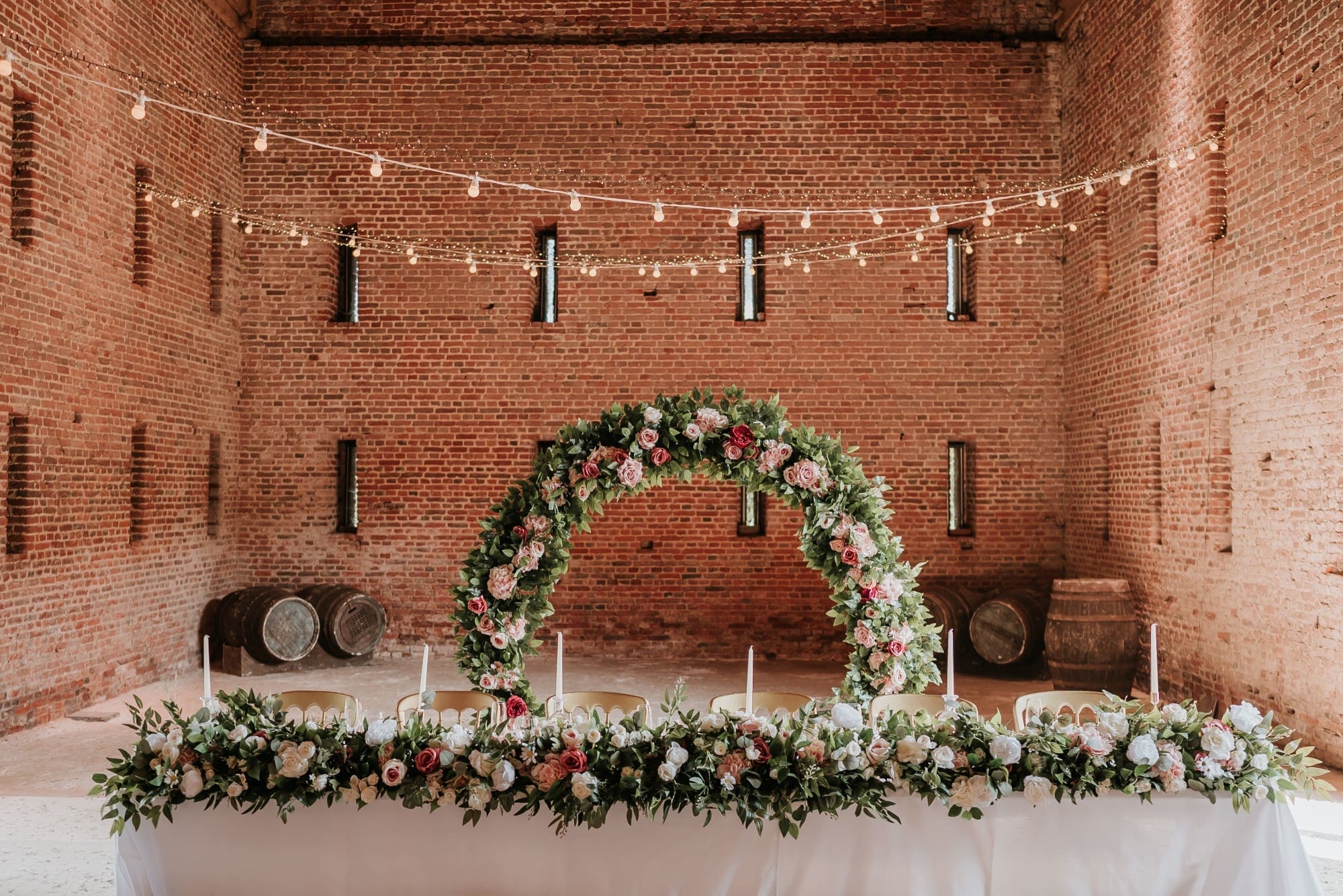 Home page photo of decorative arch and florals